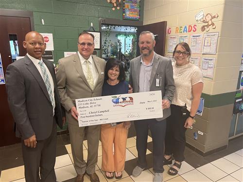 Mill Creek TOTY Cheryl Campbell with prize patrol